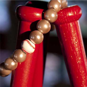 Red detail of baseball bat centerpieces from a Fenway Park fundraiser; Boston Event Planner, Boston Event Planning, Boston Event Stylist, Boston Event Styling