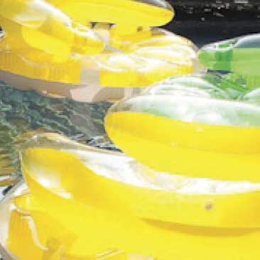 Yellow detail of floating chair inflatables from a backyard birthday pool party; Boston Event Planner, Boston Event Planning, Boston Event Stylist, Boston Event Styling
